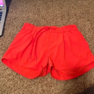 Lululemon size 6 shorts, red orange.